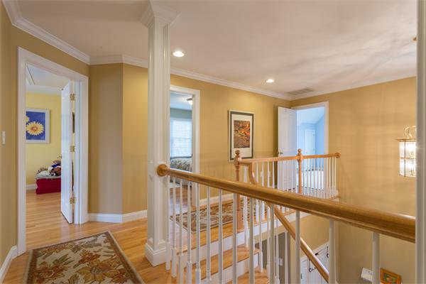 34 Bellflower Street Lexington, MA 02421 - Photo 11 of 21 a view of an entryway wooden floor and windows