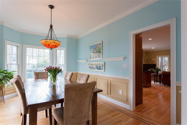 34 Bellflower Street Lexington, MA 02421 - Photo 5 of 21 a dining room with furniture a chandelier and wooden floor