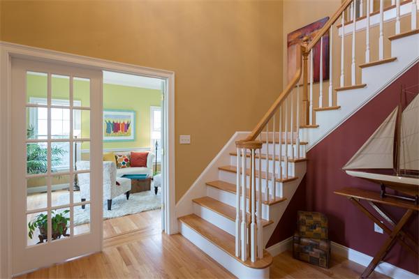 34 Bellflower Street Lexington, MA 02421 - Photo 9 of 21 a view of staircase with lots of furniture and a window