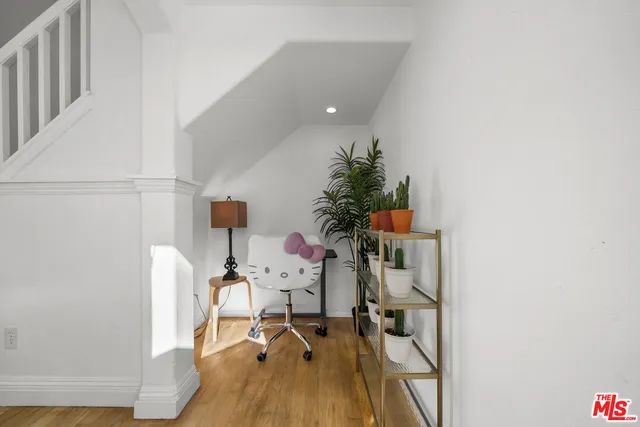 a workspace with furniture and wooden floor