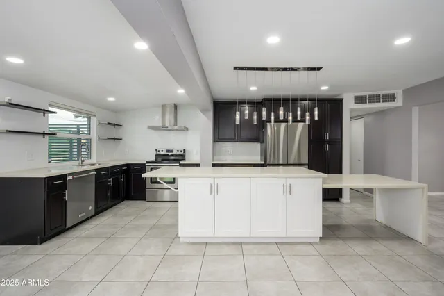 an empty room with fireplace and windows