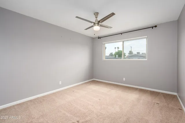 a view of a kitchen with kitchen island and living room