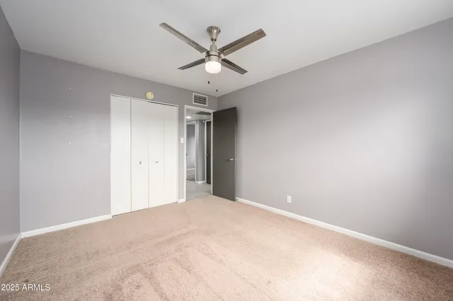 a view of a backyard with plants and patio