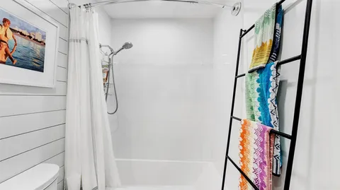 a view of a swimming pool with chairs