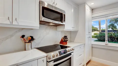 a spacious bedroom with a bed and a view of bathroom