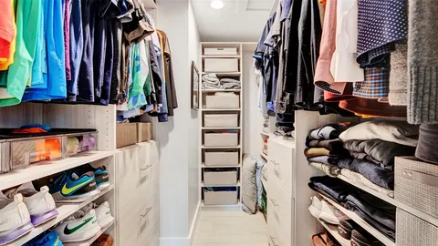 a view of a swimming pool with lounge chairs in patio