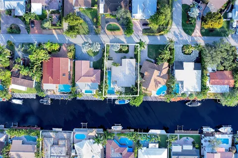 an aerial view of a house with a yard and a garden