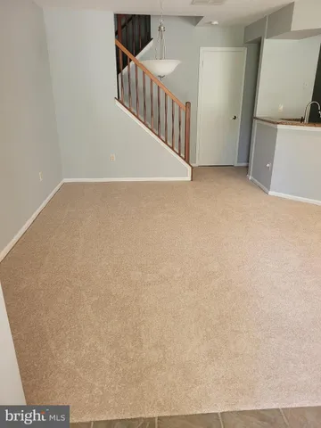 a view of a hallway with staircase
