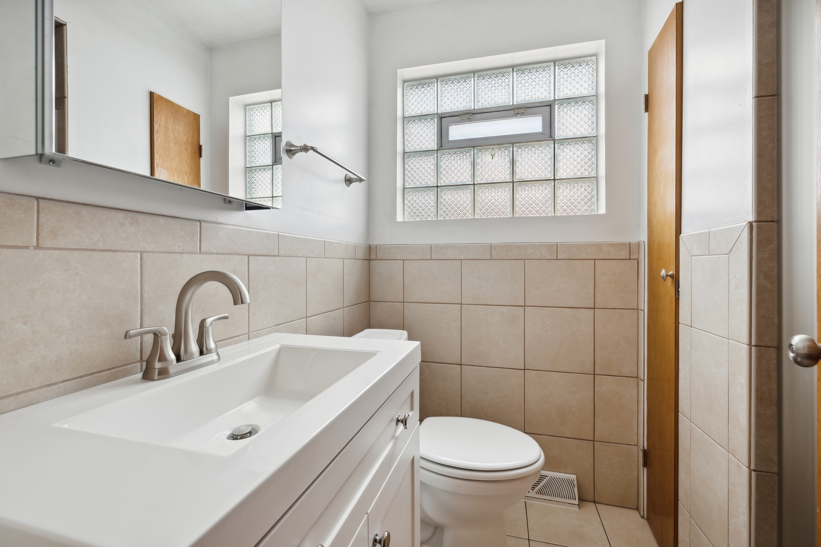 6741 West 59th Street Chicago, IL 60638 - Photo 11 of 16 a bathroom with a sink and a toilet