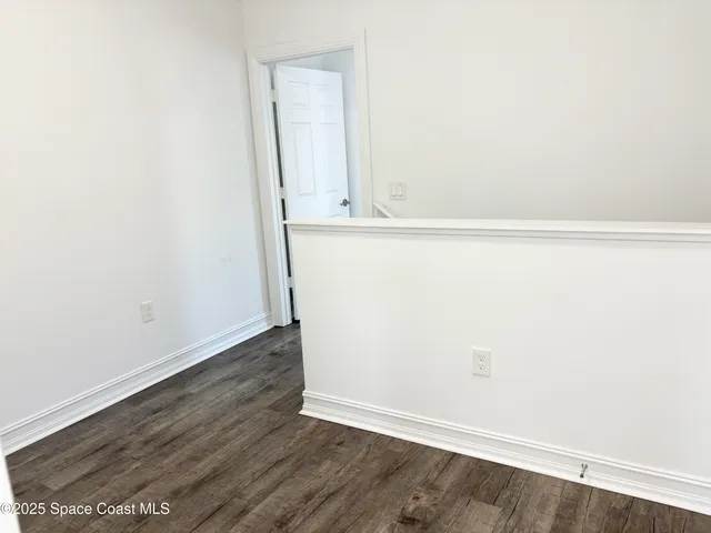 a bathroom with a granite countertop sink and mirror with bathtub