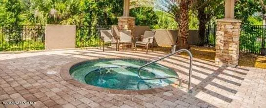 a view of a kitchen with wooden floor and staircase
