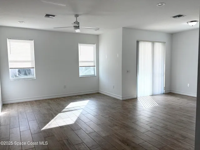 a white toilet sitting next to a sink