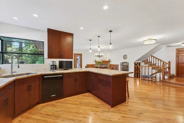 a view of dining room and hall with wooden floor