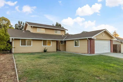 a front view of a house with yard