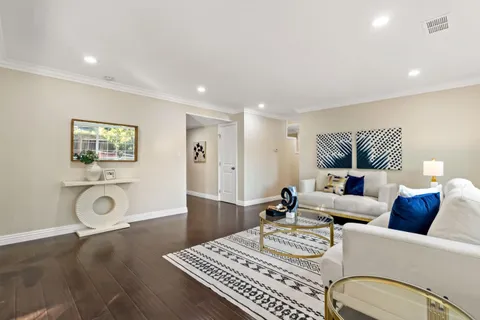 a living room with fireplace furniture and a flat screen tv