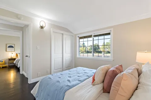 an aerial view of residential houses with outdoor space and street view