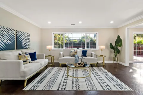 a living room with furniture rug and window