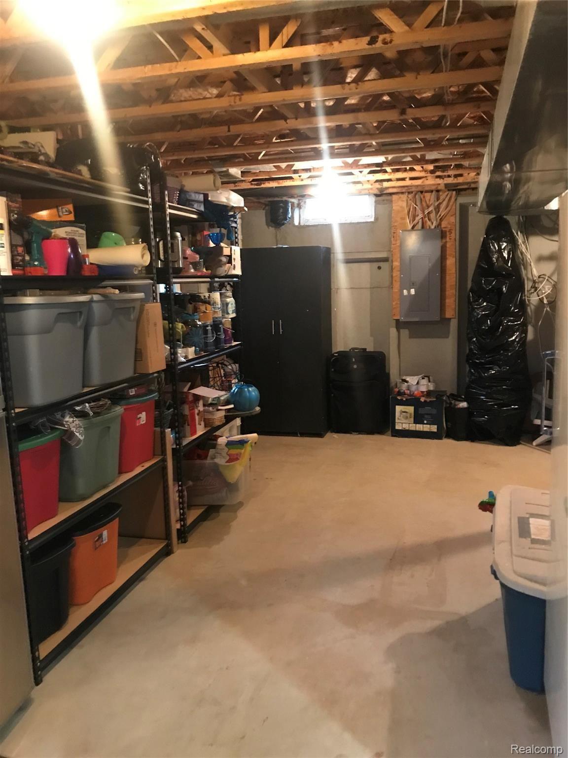 911 Deer Valley Road Holly, MI 48442 - Photo 30 of 36 Basement storage.jpg