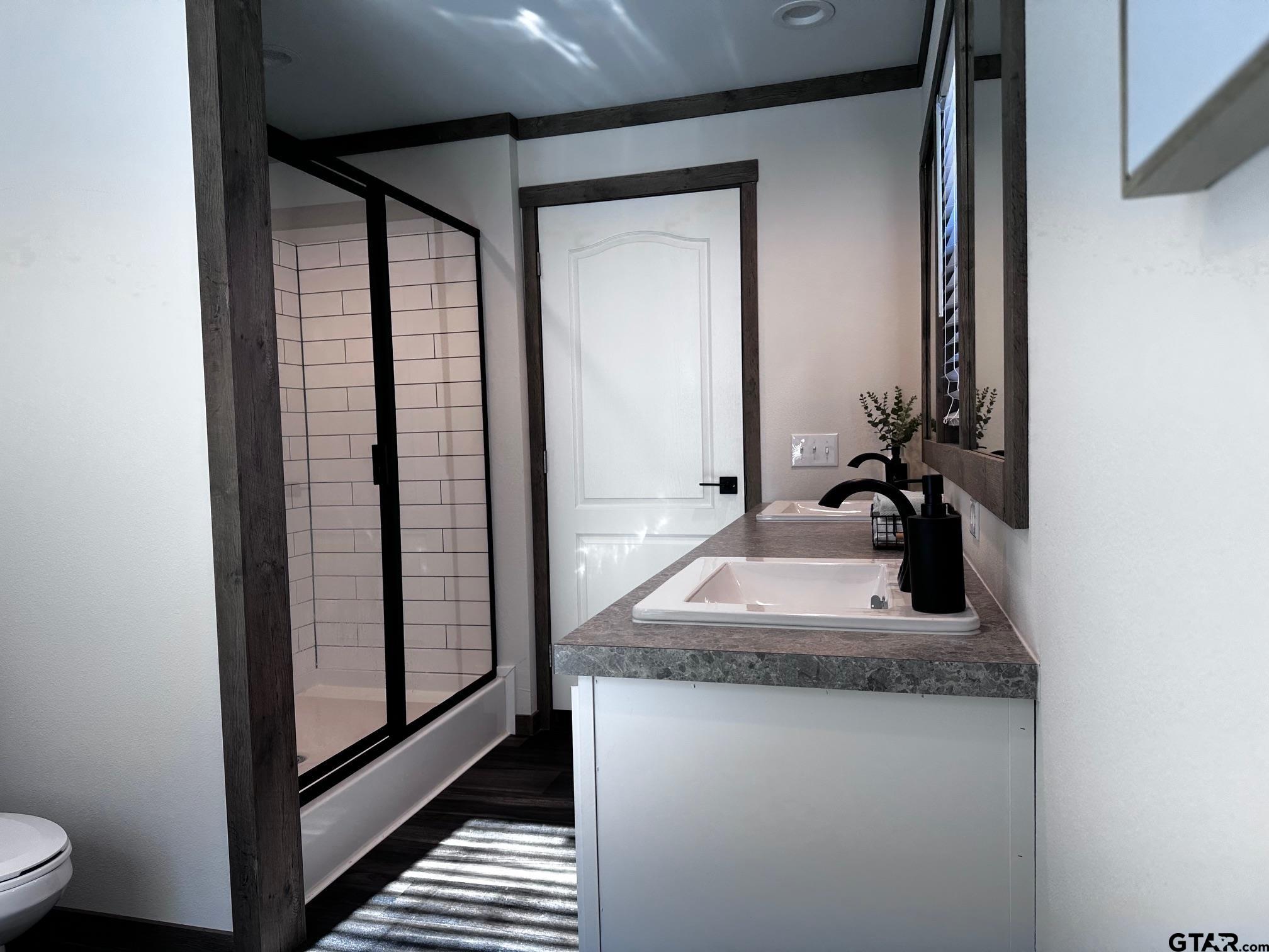 118 Private Road 5296 Alba, TX 75410 - Photo 11 of 25 a bathroom with a granite countertop sink a toilet and a mirror