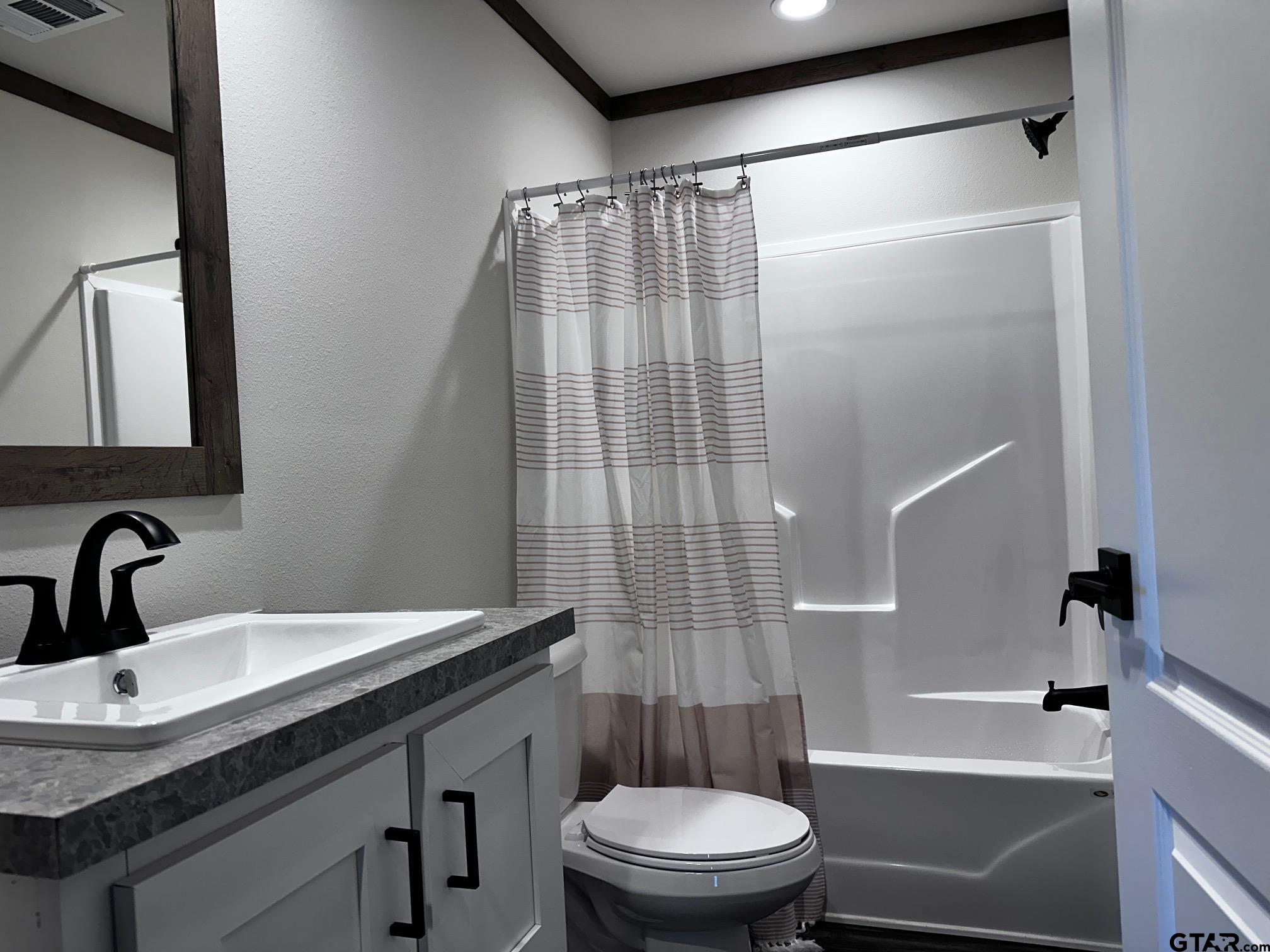 118 Private Road 5296 Alba, TX 75410 - Photo 15 of 25 a bathroom with a sink a toilet and shower