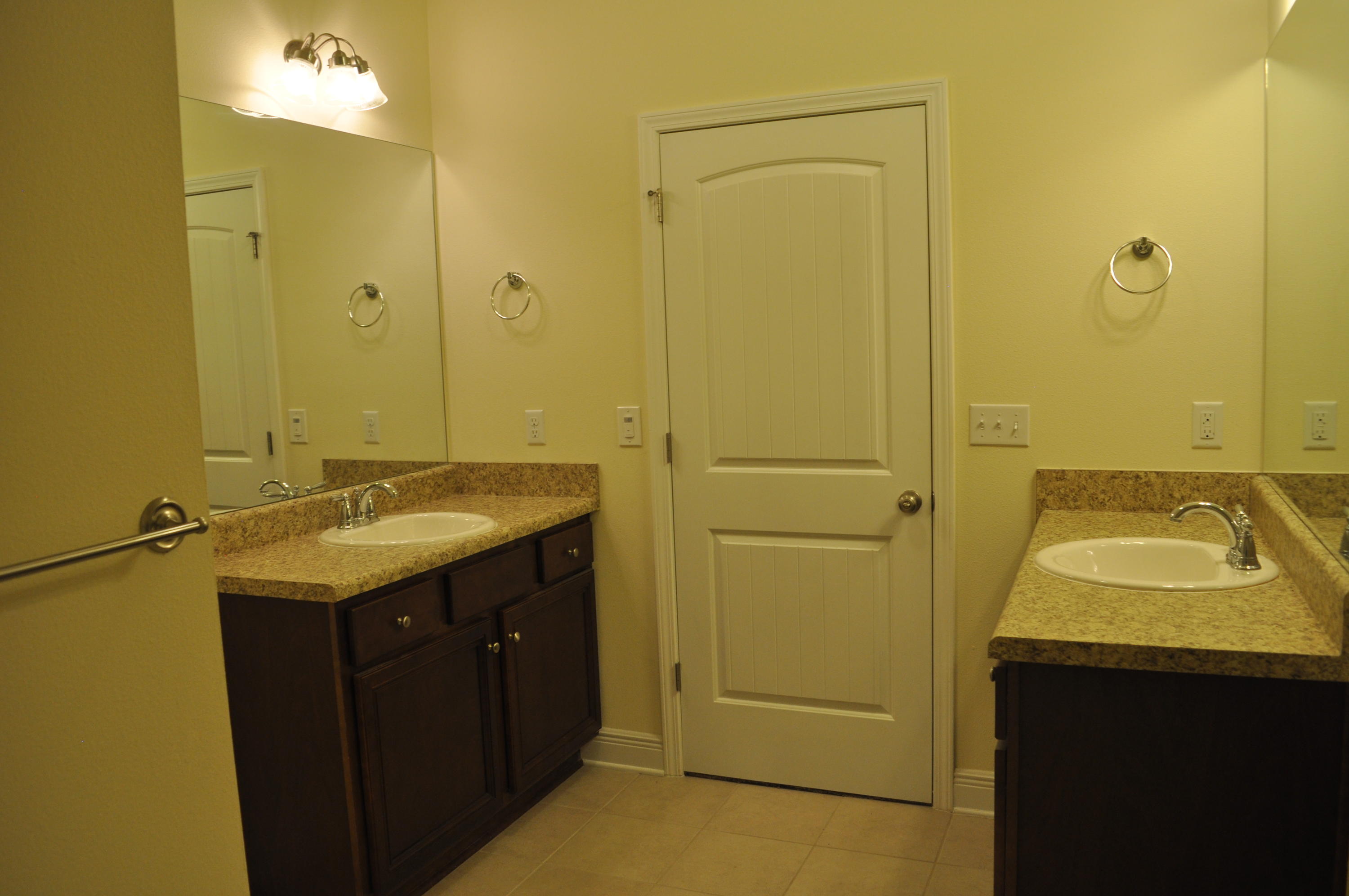 46 Nelly Street Freeport, FL 32439 - Photo 15 of 16 a bathroom with a sink and a mirror