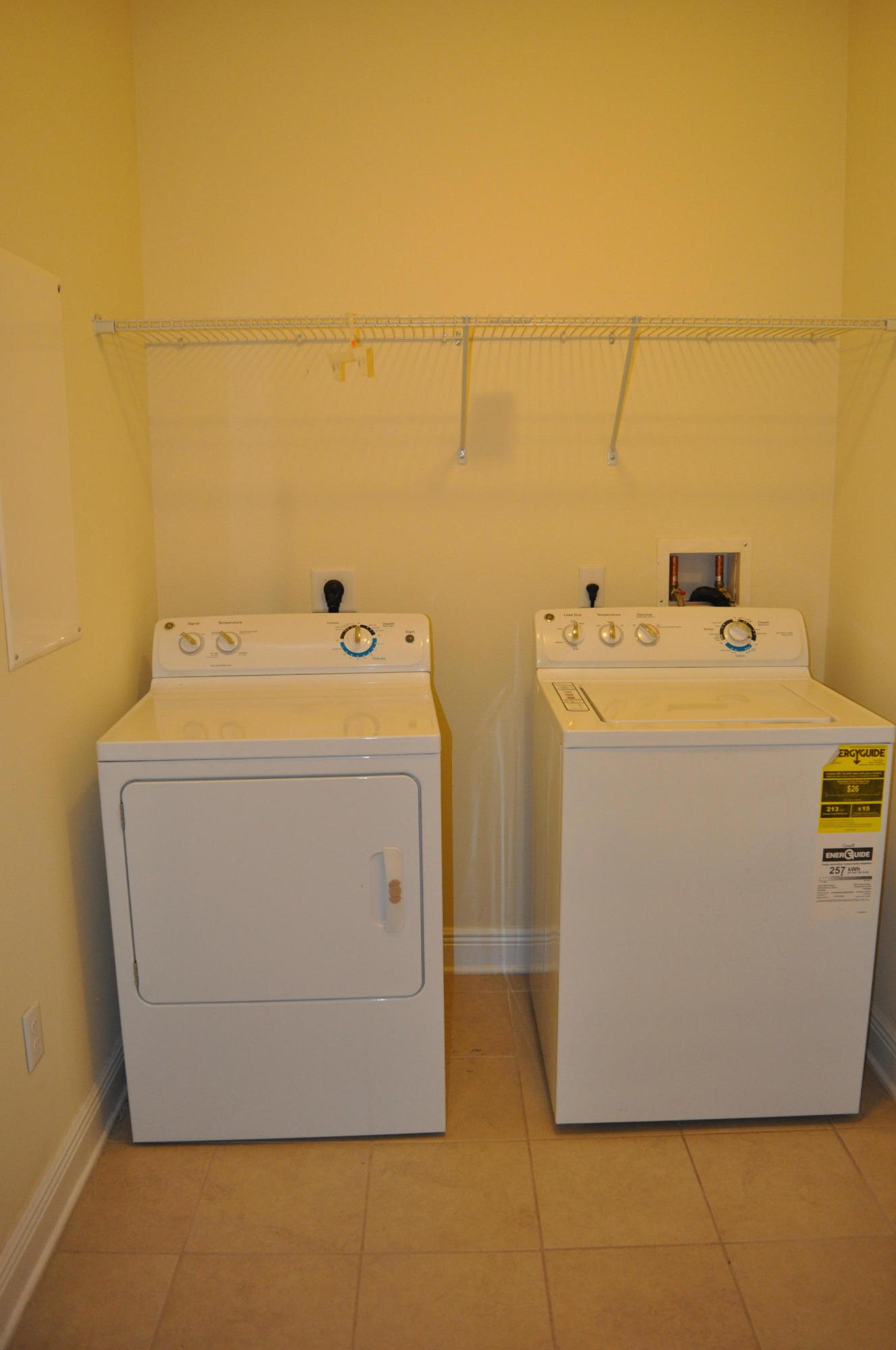 46 Nelly Street Freeport, FL 32439 - Photo 16 of 16 a utility room with dryer and washer
