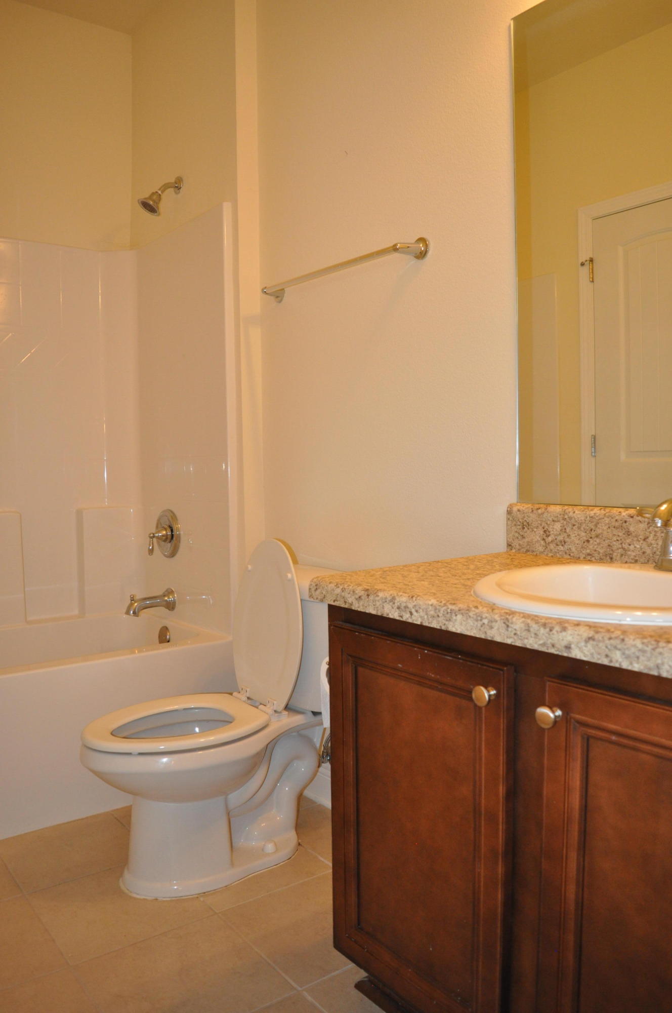 46 Nelly Street Freeport, FL 32439 - Photo 9 of 16 a bathroom with a granite countertop sink toilet and shower