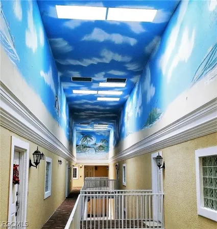 a view of a hallway with windows