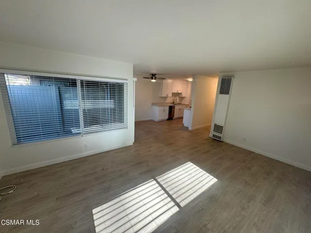 a view of wooden floor and living room