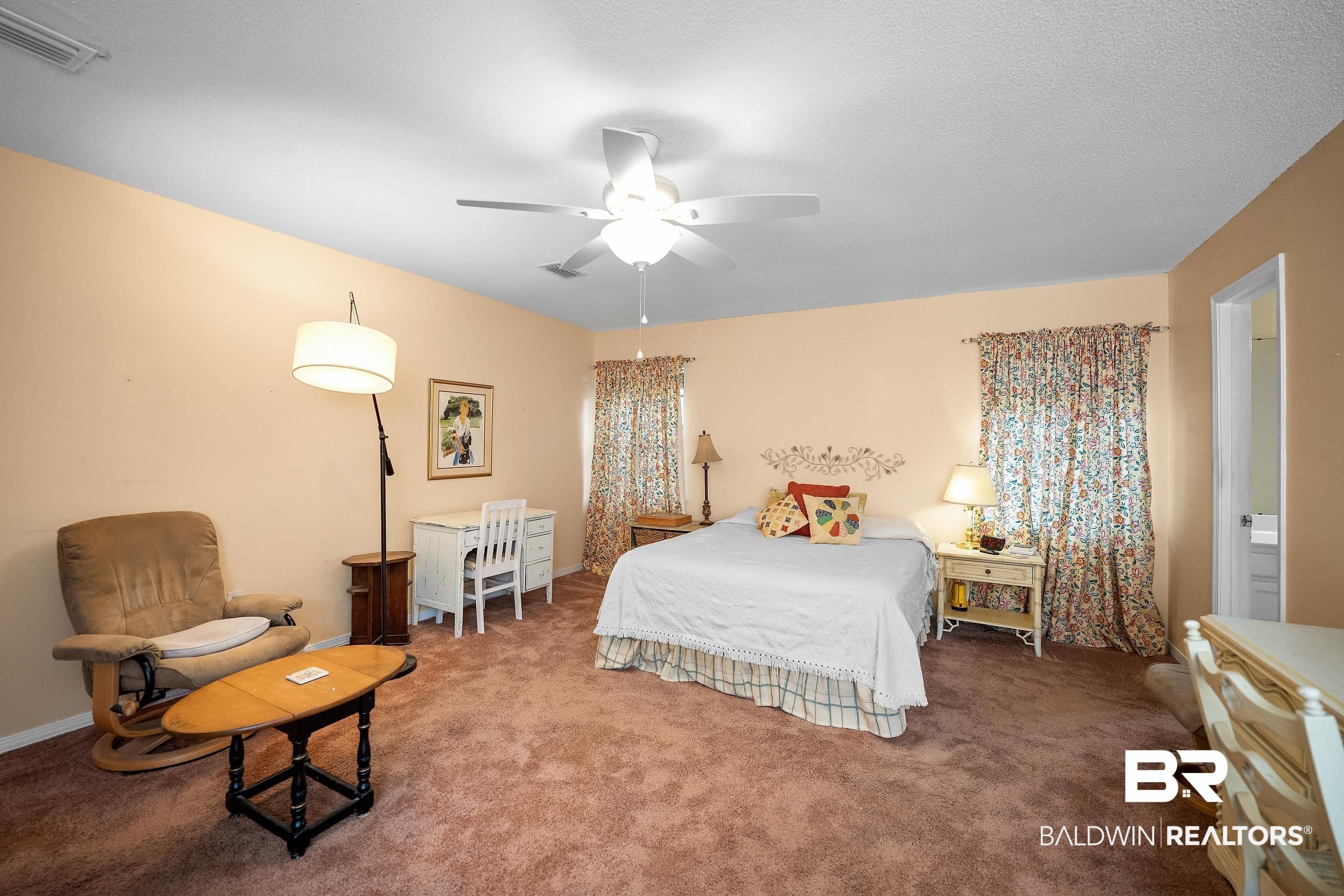 4026 Kingsrow Row Mobile, AL 36619 - Photo 19 of 51 Carpeted bedroom with ceiling fan