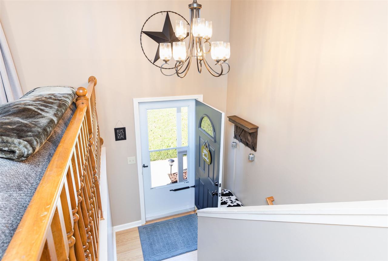 160 Buckboard Road Waynesboro, VA 22980 - Photo 12 of 34 a view of living room with a bed and a chandelier