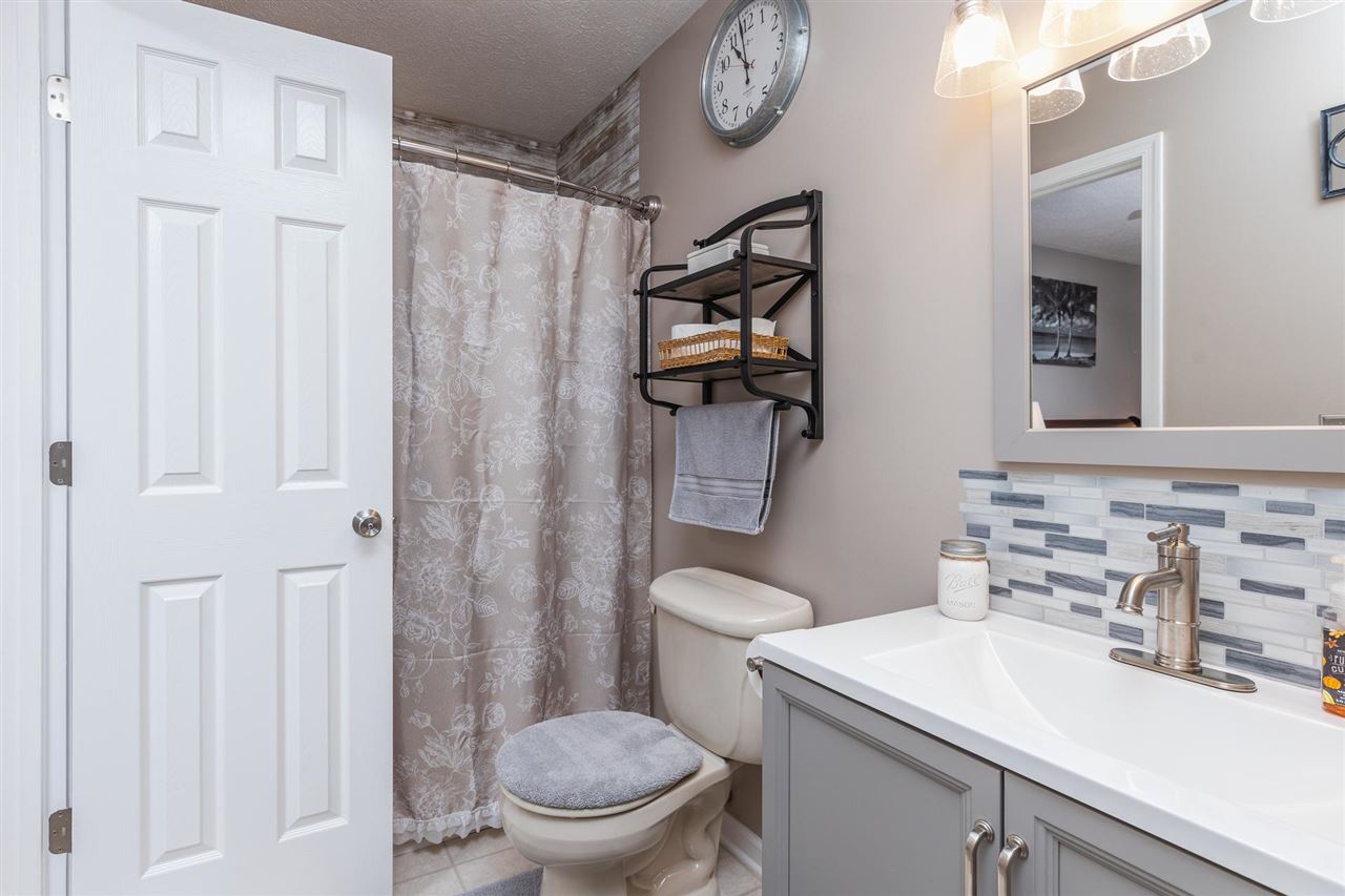160 Buckboard Road Waynesboro, VA 22980 - Photo 16 of 34 a bathroom with a sink a toilet and shower curtain
