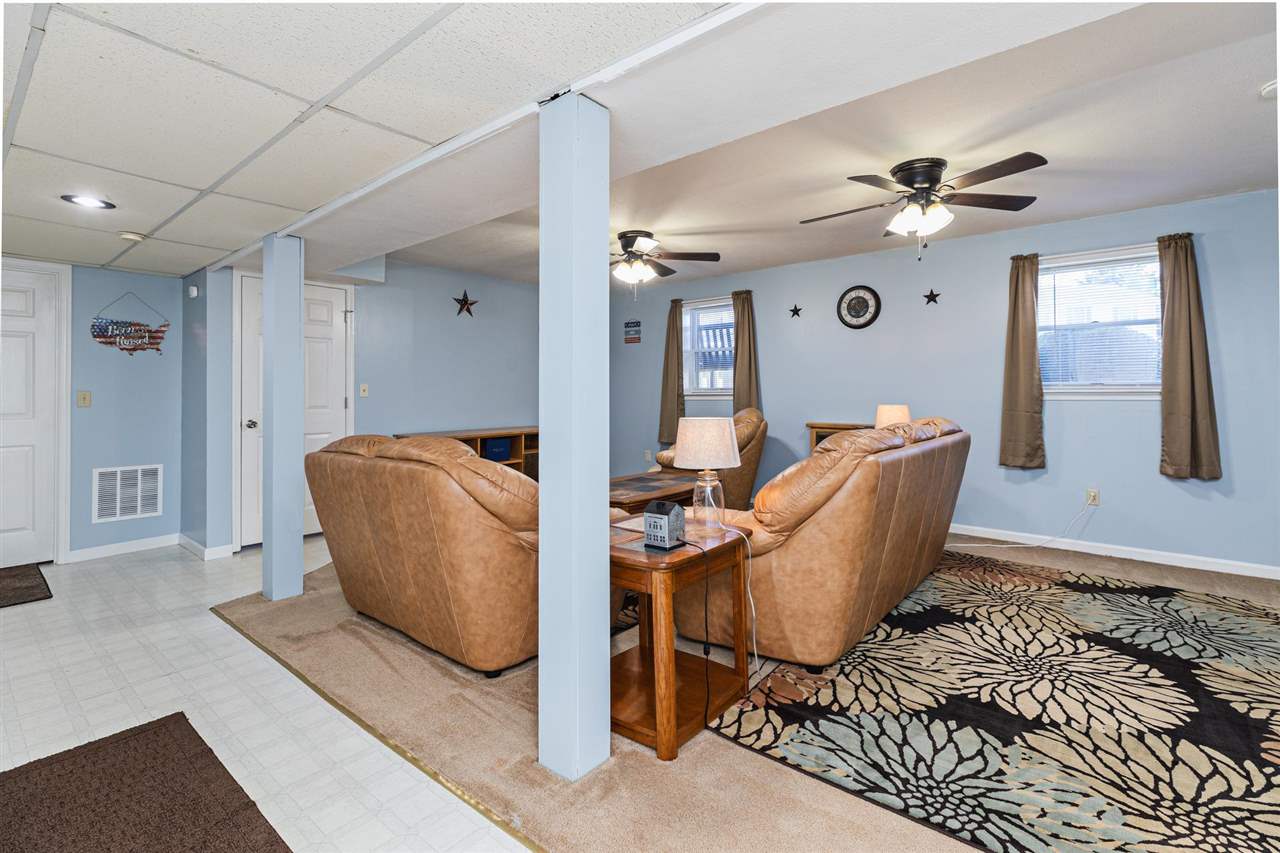 160 Buckboard Road Waynesboro, VA 22980 - Photo 21 of 34 a living room with furniture a window and a chandelier