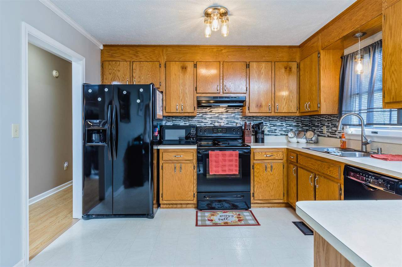 160 Buckboard Road Waynesboro, VA 22980 - Photo 3 of 34 a kitchen with stainless steel appliances kitchen island granite countertop a refrigerator and a sink