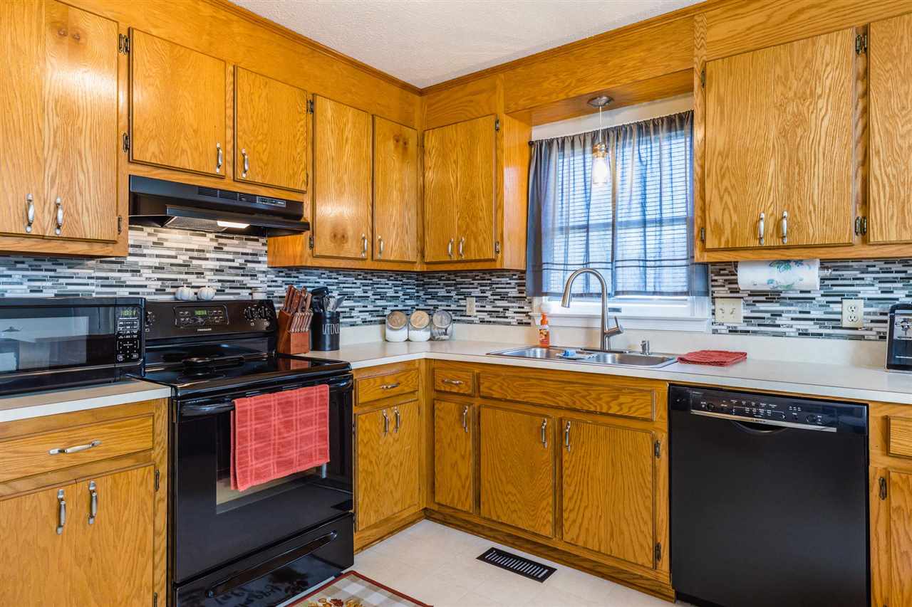 160 Buckboard Road Waynesboro, VA 22980 - Photo 7 of 34 a kitchen with granite countertop cabinets stainless steel appliances a sink and wooden floor