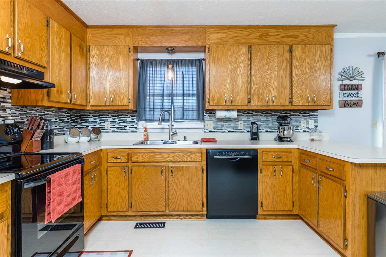 160 Buckboard Road Waynesboro, VA 22980 - Photo 8 of 34 a kitchen with stainless steel appliances granite countertop a sink stove and cabinets