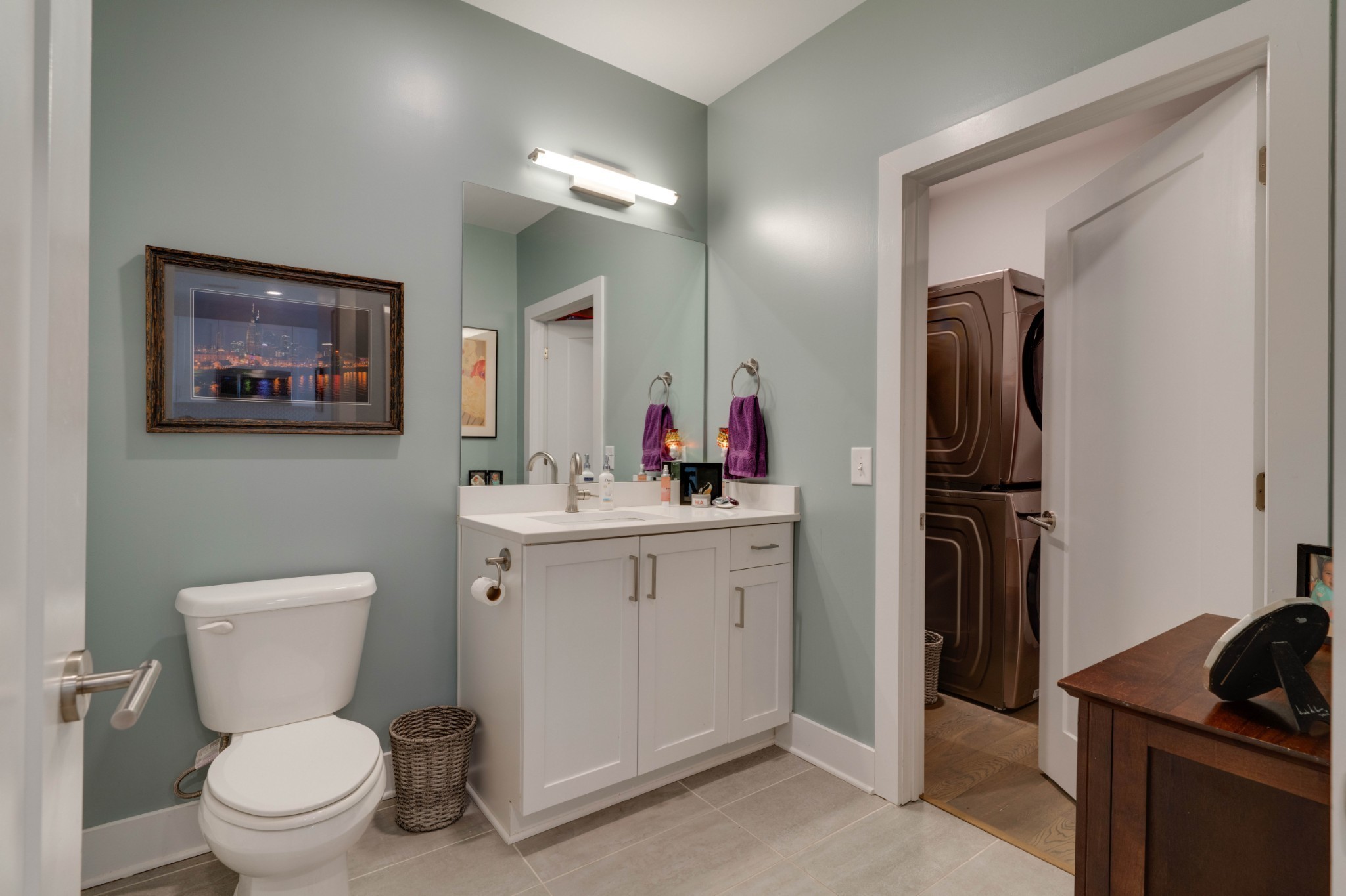 1041 East Trinity Lane, Unit 315 Nashville, TN 37216 - Photo 16 of 48 a bathroom with a toilet sink and mirror