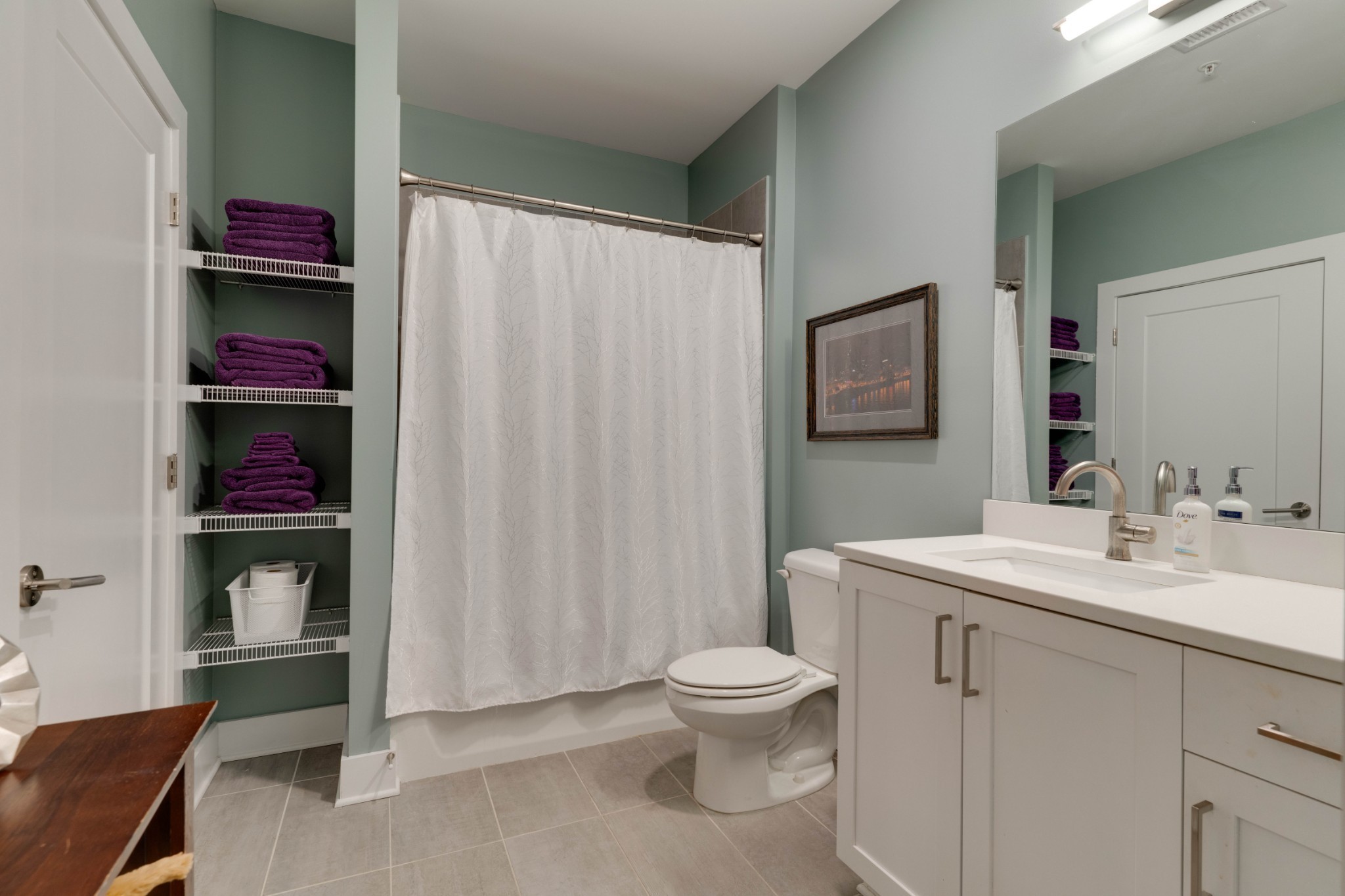 1041 East Trinity Lane, Unit 315 Nashville, TN 37216 - Photo 18 of 48 a spacious bathroom with a toilet sink and shower