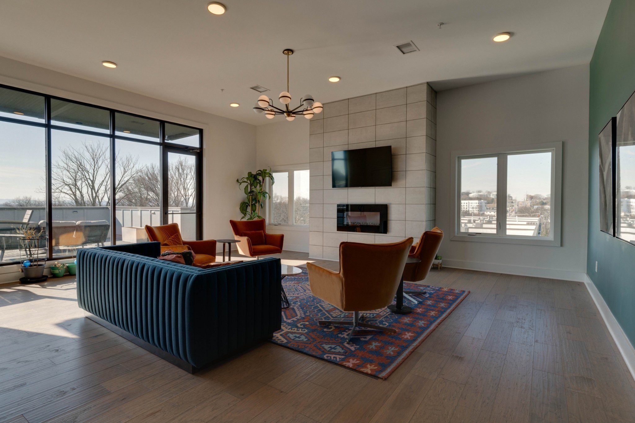 1041 East Trinity Lane, Unit 315 Nashville, TN 37216 - Photo 22 of 48 a living room with furniture a fireplace and a flat screen tv