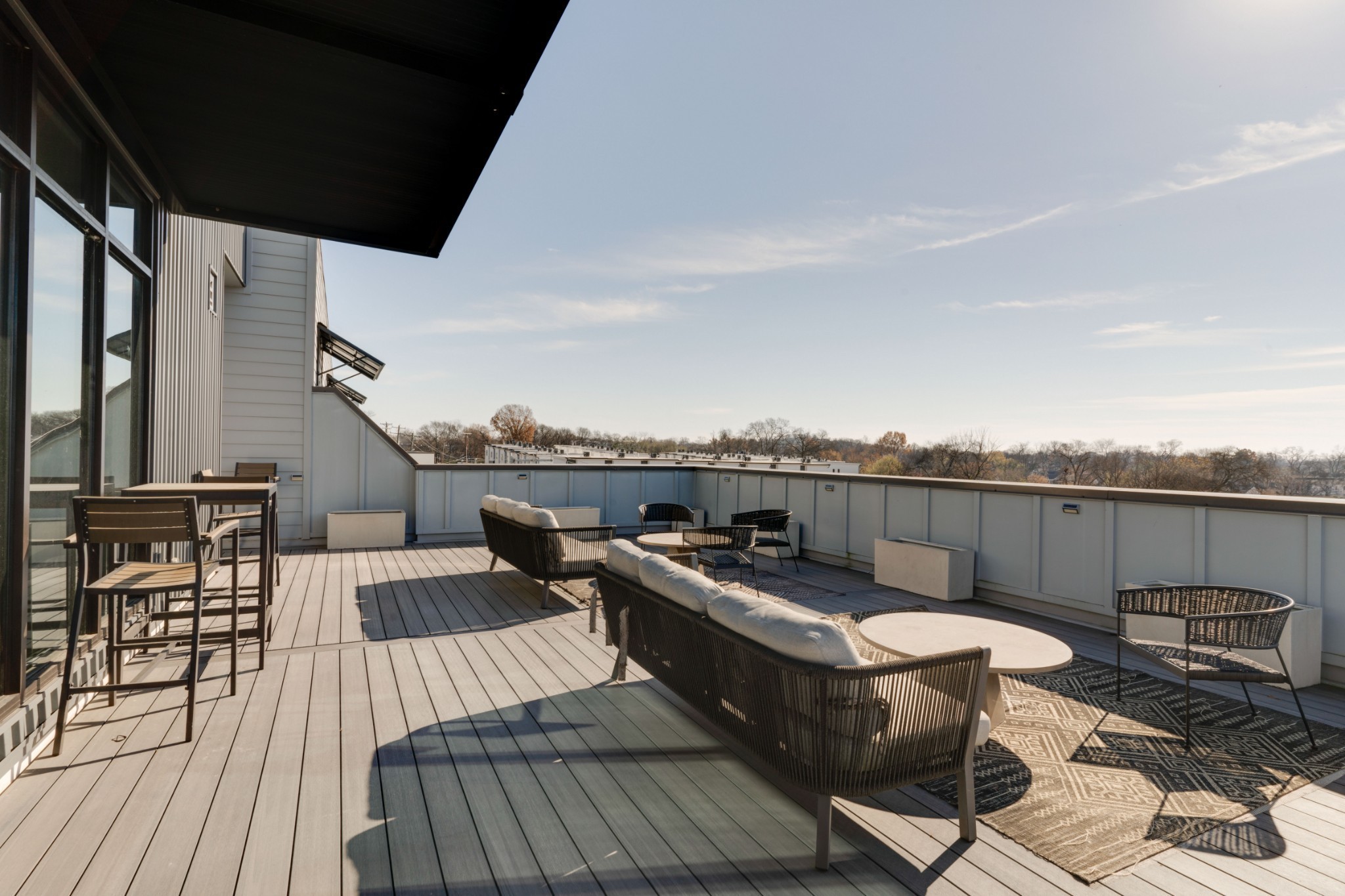 1041 East Trinity Lane, Unit 315 Nashville, TN 37216 - Photo 23 of 48 a view of a balcony with chairs and wooden floor
