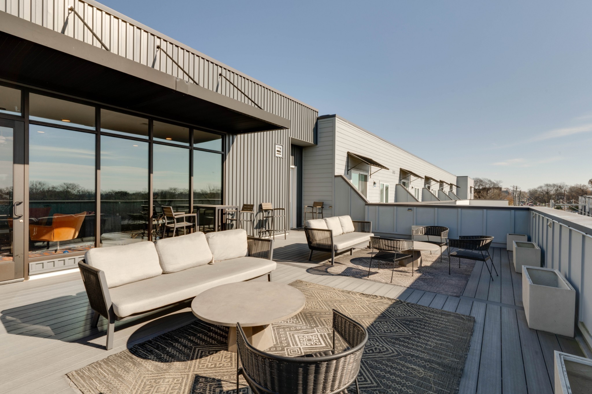 1041 East Trinity Lane, Unit 315 Nashville, TN 37216 - Photo 28 of 48 a outdoor space with patio the couches and a dining table with garden view
