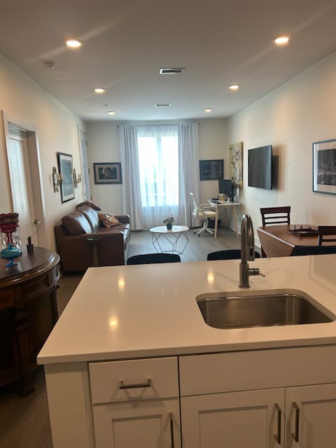 1041 East Trinity Lane, Unit 315 Nashville, TN 37216 - Photo 3 of 48 a kitchen with a sink and a refrigerator