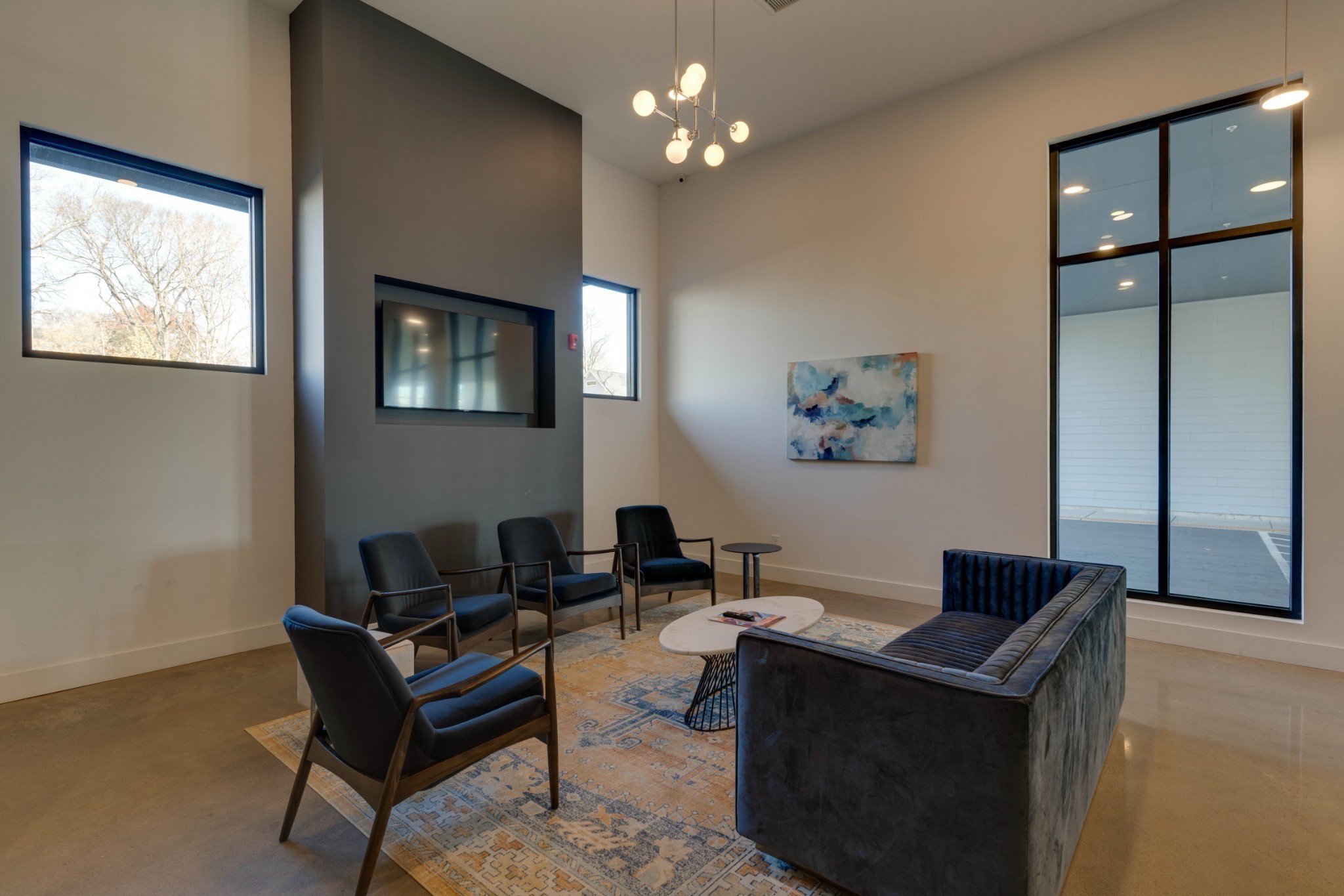 1041 East Trinity Lane, Unit 315 Nashville, TN 37216 - Photo 34 of 48 a living room with furniture a desk and chair