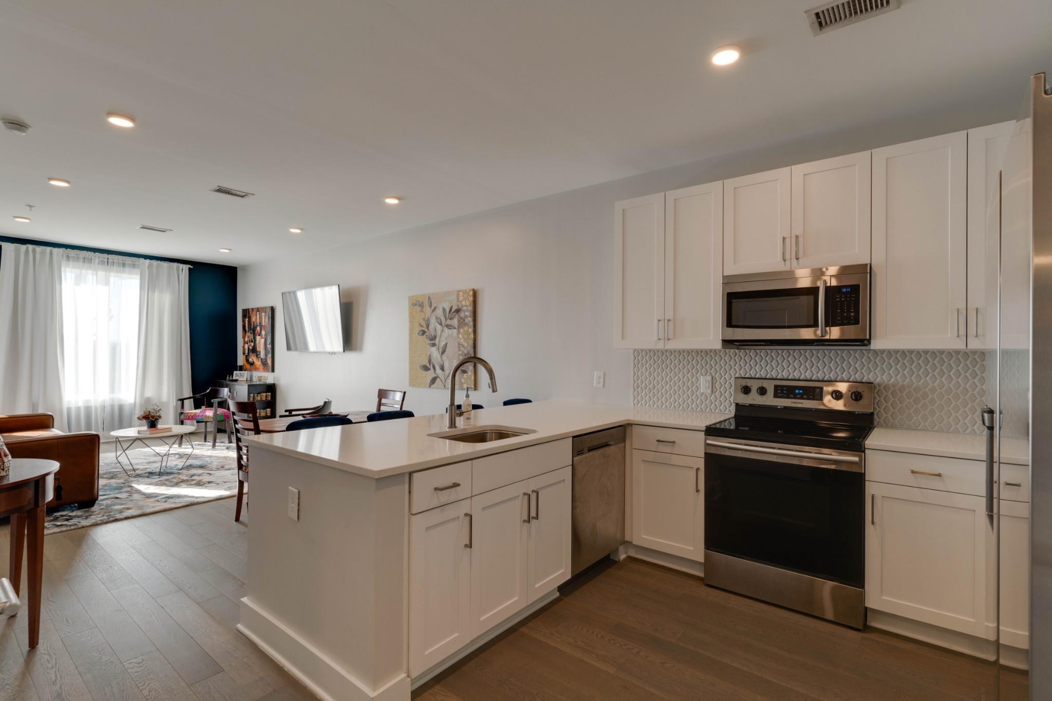 1041 East Trinity Lane, Unit 315 Nashville, TN 37216 - Photo 6 of 48 a kitchen with stainless steel appliances granite countertop a sink stove oven and refrigerator