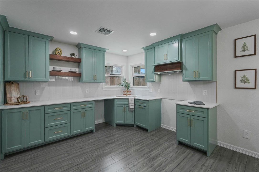 5409 Timbergate Drive Corpus Christi, TX 78413 - Photo 12 of 29 a kitchen with stainless steel appliances granite countertop wooden cabinets and a stove top oven