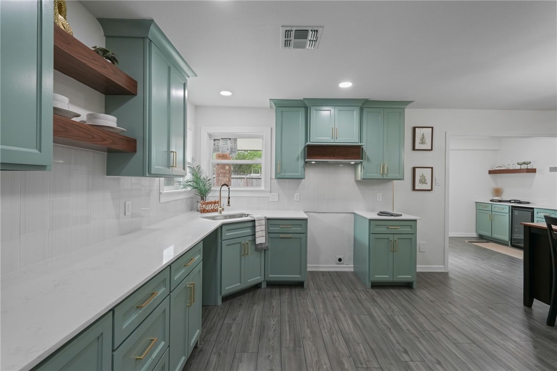 5409 Timbergate Drive Corpus Christi, TX 78413 - Photo 13 of 29 a kitchen with stainless steel appliances granite countertop a sink stove and cabinets