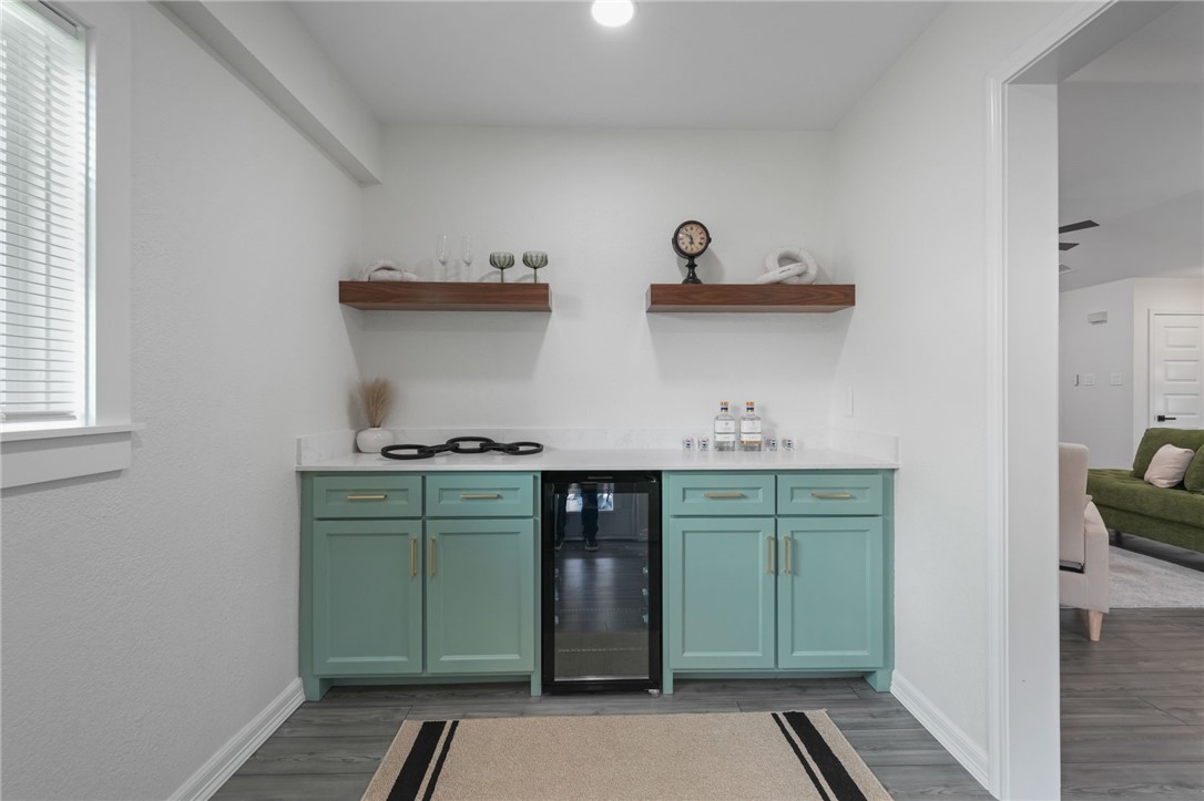 5409 Timbergate Drive Corpus Christi, TX 78413 - Photo 15 of 29 a kitchen with cabinets a washer and dryer