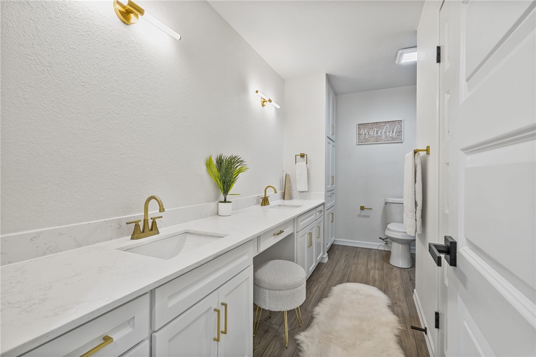 5409 Timbergate Drive Corpus Christi, TX 78413 - Photo 19 of 29 a spacious bathroom with a granite countertop sink and a mirror