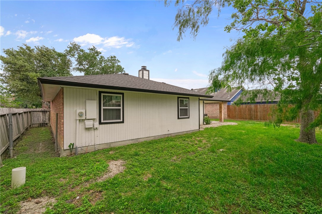 5409 Timbergate Drive Corpus Christi, TX 78413 - Photo 29 of 29 a view of a backyard with plants and large tree