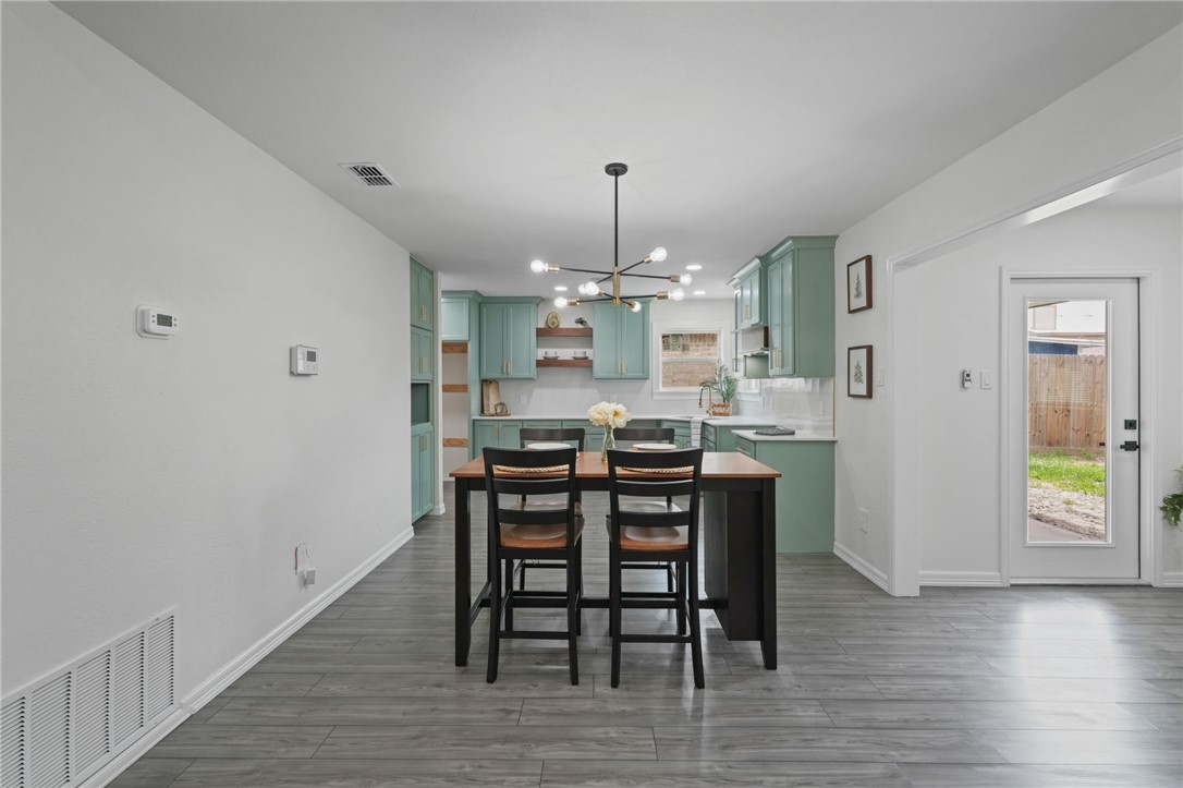 5409 Timbergate Drive Corpus Christi, TX 78413 - Photo 9 of 29 a view of a dining room with furniture and wooden floor